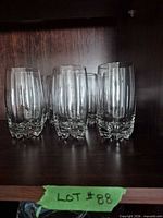 Front view of all seven tumblers on shelf