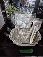 Full grouping on tray showing glasses, napkin holders, tray, figurines, coasters
