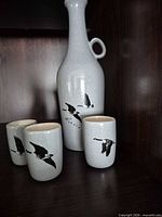 Full set showing decanter and three cups
