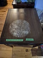 top view showing overall table surface with circular wear and taped dimensions