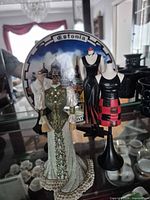 Group shot: four figurines and Estonia plate