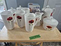 Full set showing mugs, teapot, creamer, sugar bowl, canisters, boxed honey jar