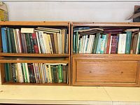 Two wooden cube bookcases loaded with numerous books on botany and soil science