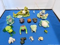 All fifteen frog figurines laid out for overview