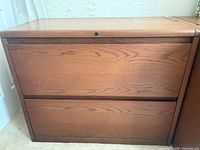 Front view showing two drawers and lock