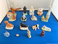 All 17 figurines arranged on blue surface