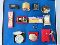 Group shot of all fourteen vintage travel accessories on blue background