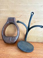 Wooden stirrup and cast iron step side by side