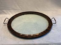 Full view of oval wood and glass serving tray