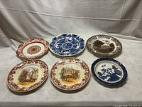 All five ceramic pieces displayed front view