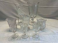 Group shot of all eight pressed glass pieces