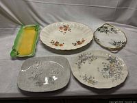 Group shot of five serving pieces on table