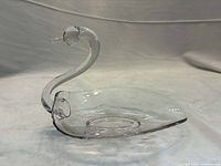 Side profile of clear glass swan dish