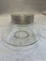 Stack of eight clear etched sherbet plates