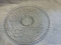 Top view of 13-inch Candlewick torte plate showing etched floral pattern and beaded rim