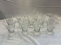 Full set of fifteen footed juice tumblers displayed