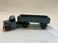 driver side view, cab hitched to trailer