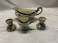 Gravy boat, creamer and two bud vases group view