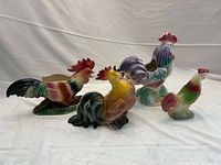 Group shot of the four ceramic rooster planters/figurines