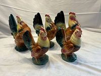 Five multicolored ceramic hens grouped