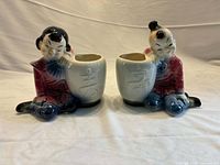 Both Royal Copley Oriental boy and girl planters front view