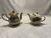 Both teapots side by side to show overall design and size comparison