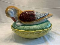 Front view of covered server showing duck, duckling, lid and base