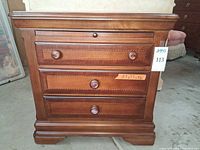 Front view of 3-drawer nightstand