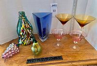 All nine glass items displayed on table
