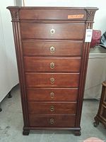 Full front view of Ethan Allen tall chest showing seven drawers and overall condition