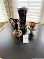 All three Greek ceramic pieces grouped