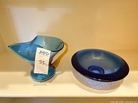 Front view showing bowl and pitcher together with auction tag