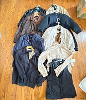 Group view of all nine jackets and coats laid out