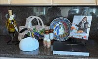 Full lot overview showing books, basket, plate, shakers, kettle, oil bottle