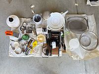 Full lot overview on floor showing all utensils and gadgets