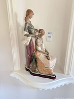 Full view of Lladró figurine showing both women and base