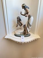 Full view of Lladro Egyptian figurine on shelf
