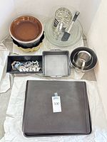 Overview showing all bakeware, bowls, cutters, spatula, sifter