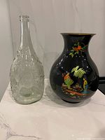 Vase and bottle side by side