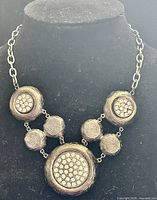 Front view of necklace on display bust