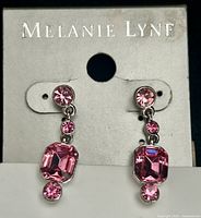 Front view of both earrings on original card showing overall design and branding