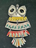 Front view of articulated multicolor enamel owl pendant
