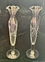 Full view of both etched glass vases standing upright