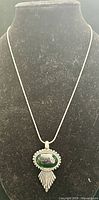 Front view of entire necklace on display form