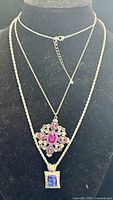 Both necklaces on display bust showing overall appearance and chain lengths