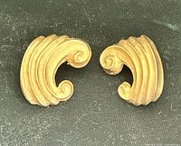 Front view of both gold-tone Givenchy earrings
