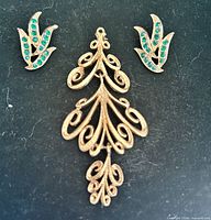 Front view of earrings and pendant showing design and stone colour