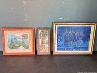 All three framed artworks side by side