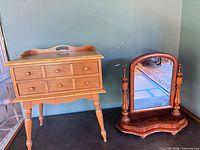 Side table and tilt mirror together to show lot contents and scale