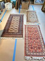 All three rugs laid out side by side